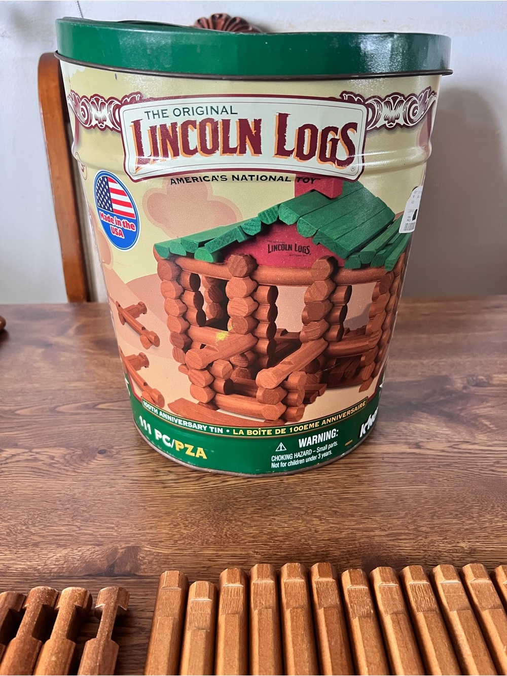 Tin of Lincoln Logs by K’Nex